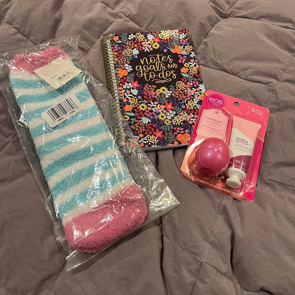 Lip balm, hand cream, notebook for notes, goals, & to-dos, warm cozy socks.